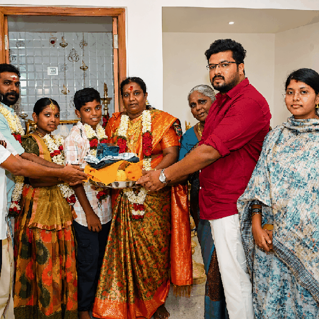 Alnitak Construction team with satisfied client at project site in Tiruppur